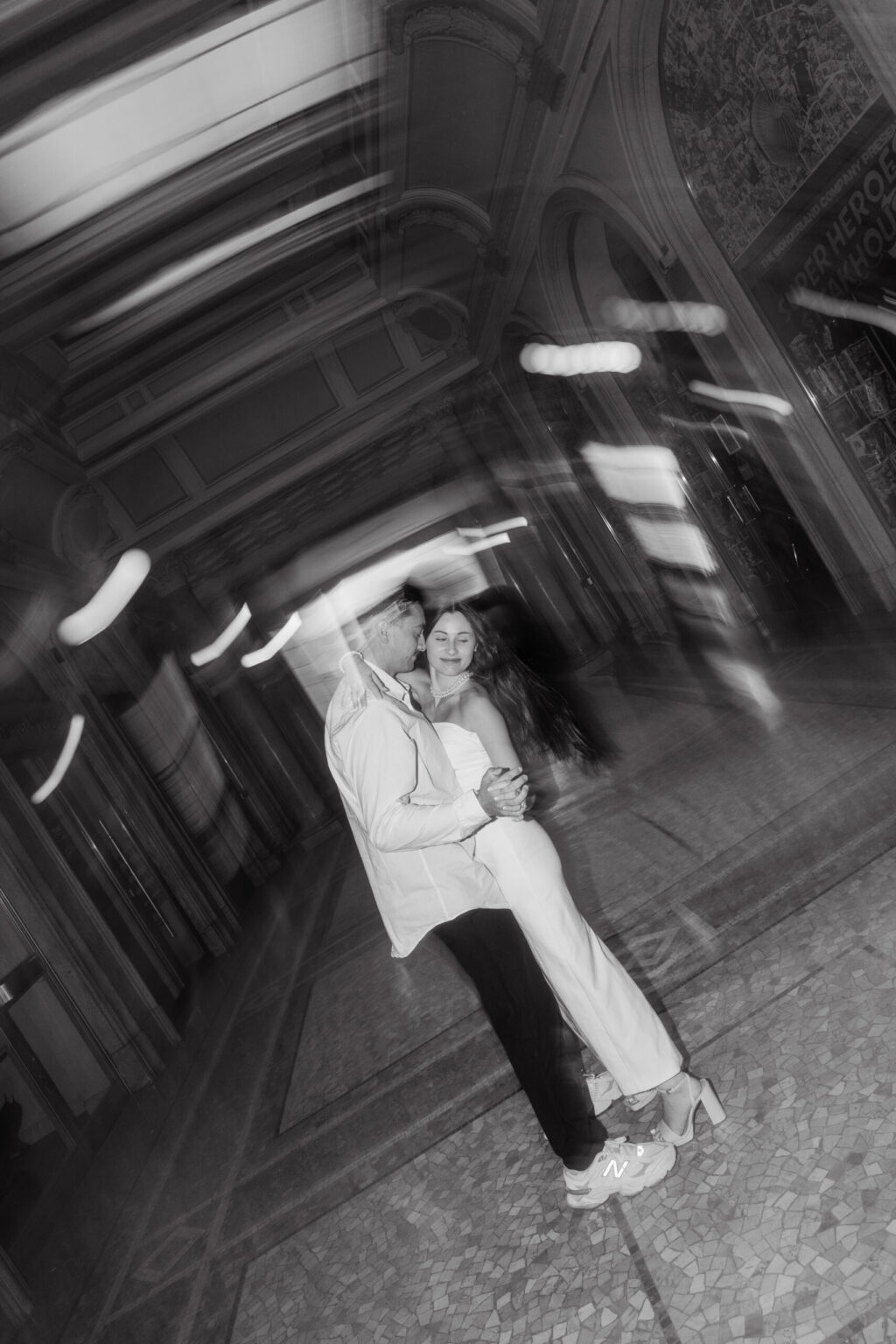 Destination engagement photoshoot of a couple in Milan at Galleria Vittorio Emanuele II, captured by destination wedding photographer Paulina Hindy.